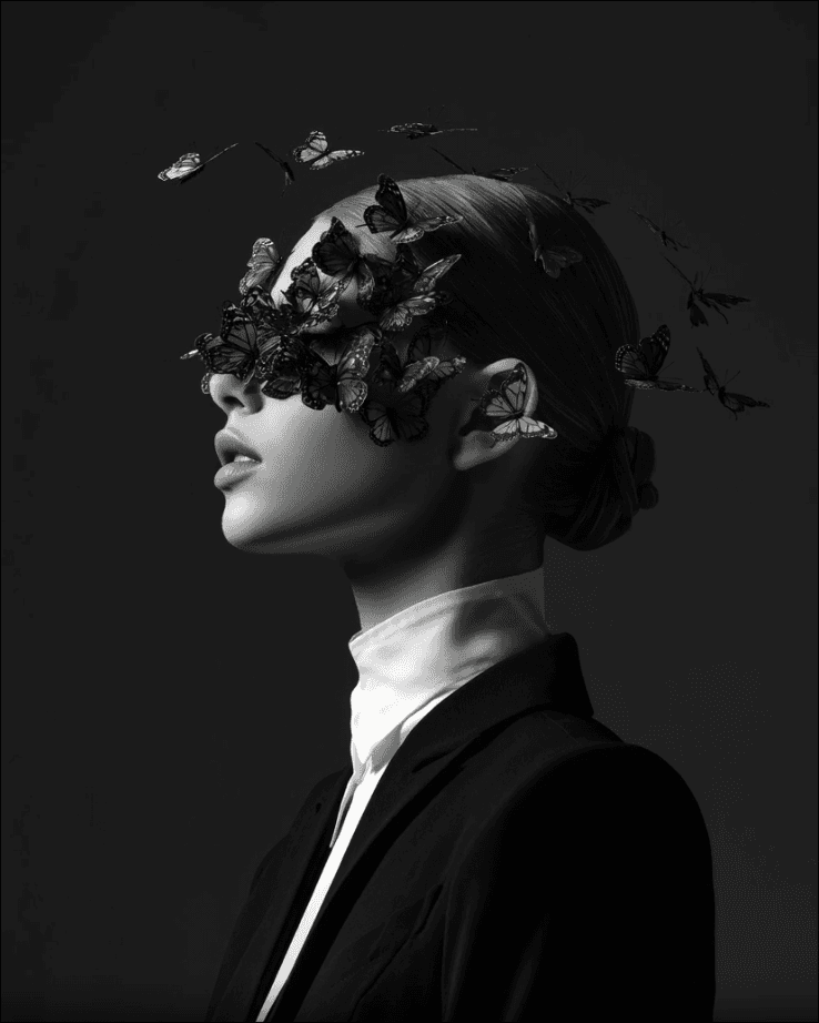 Black-and-white portrait with butterflies for the NORTH/FORM studio concept
