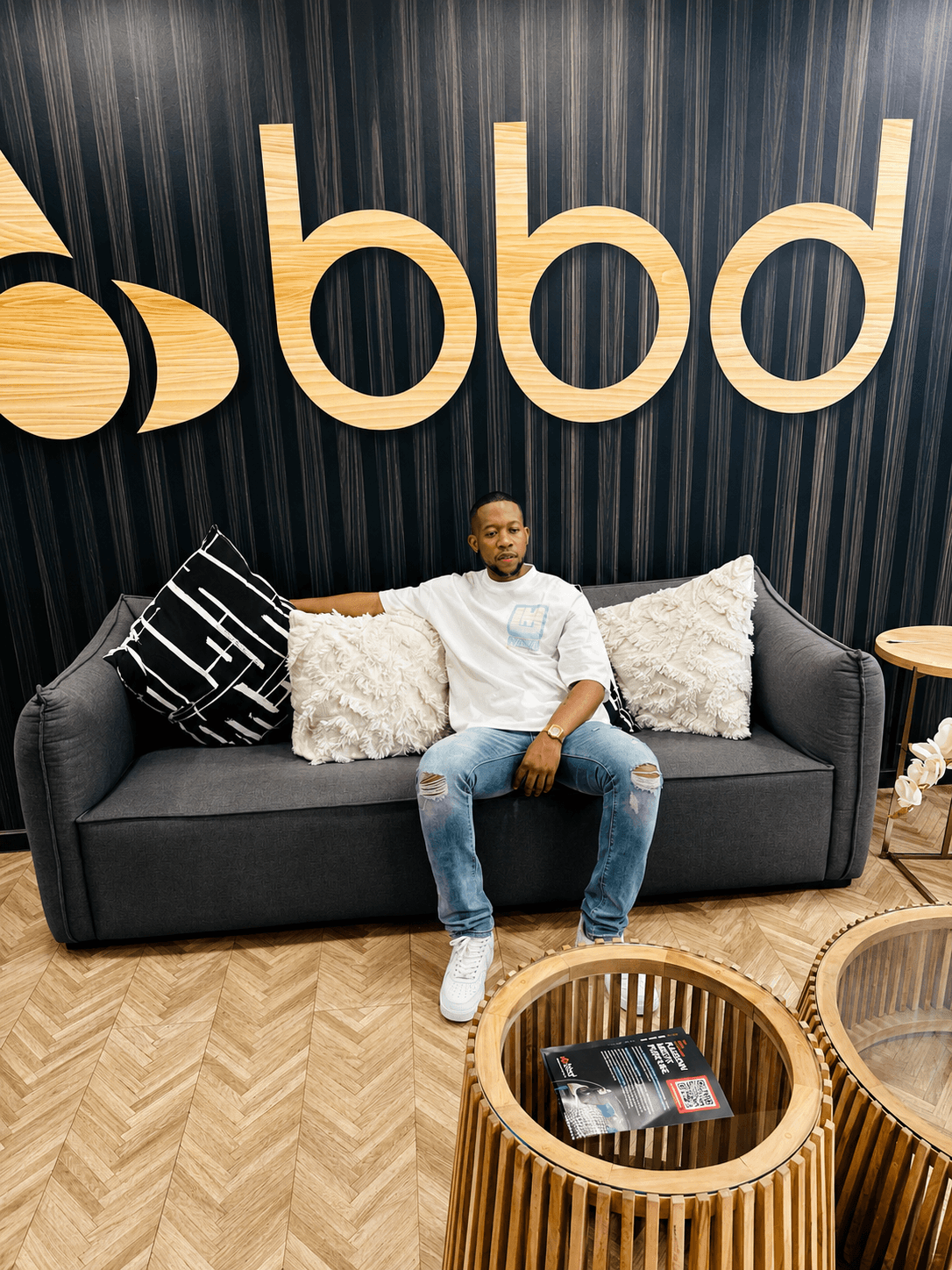 Thapelo Mthize seated in a studio lounge